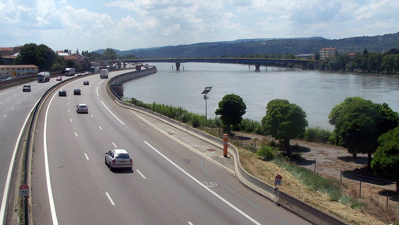 Sight of the French A7 motorway, here bordering the Rhône river (right) and the city of Valence (left).