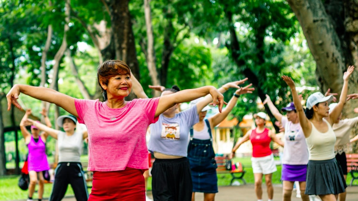 Group of women exercising together in a park