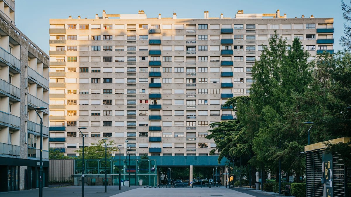 An empty street in front of a tall building