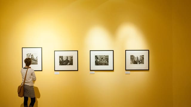3 black wooden framed wall mounted photos