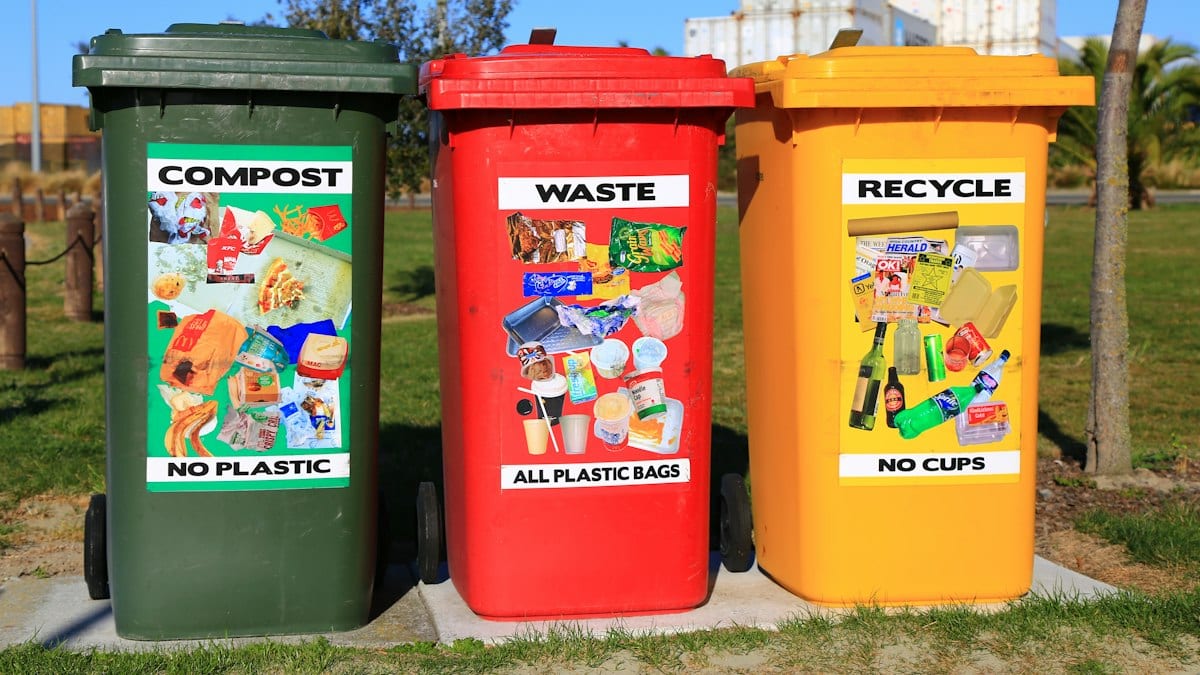 red yellow and green trash bins