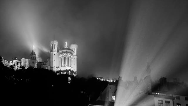 A black and white photo of a city at night