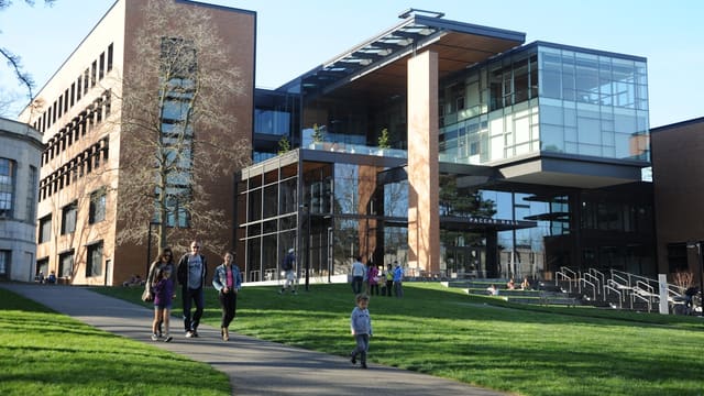 people walking near Paccar Hall University of Washington during daytime