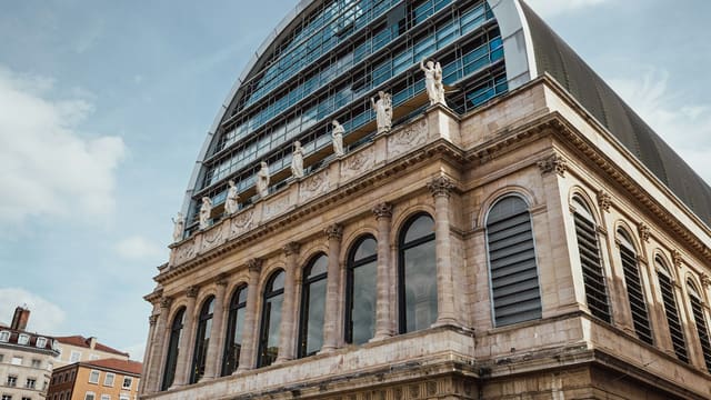 Modern glass dome on historic stone building
