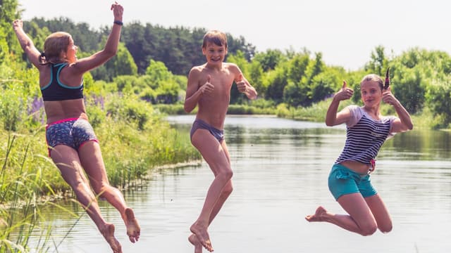 2 men running on water during daytime