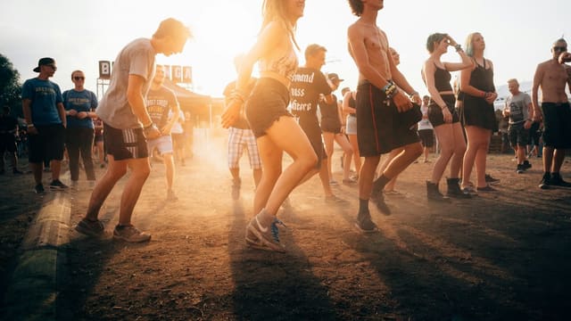 people dancing during sunset