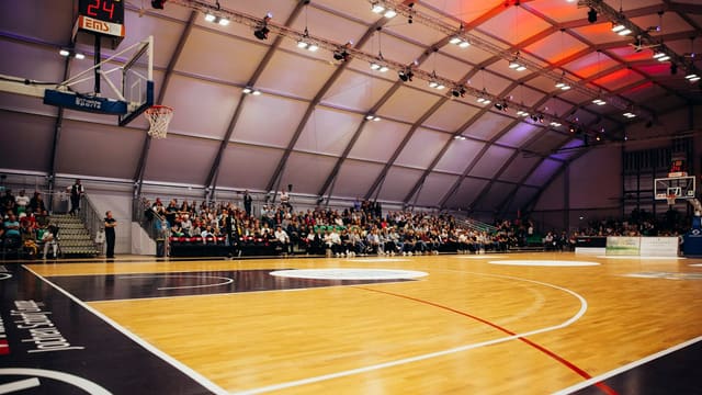 people inside a basketball gym