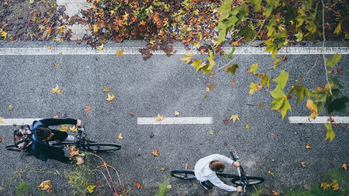 aerial photography of man riding bike on streets